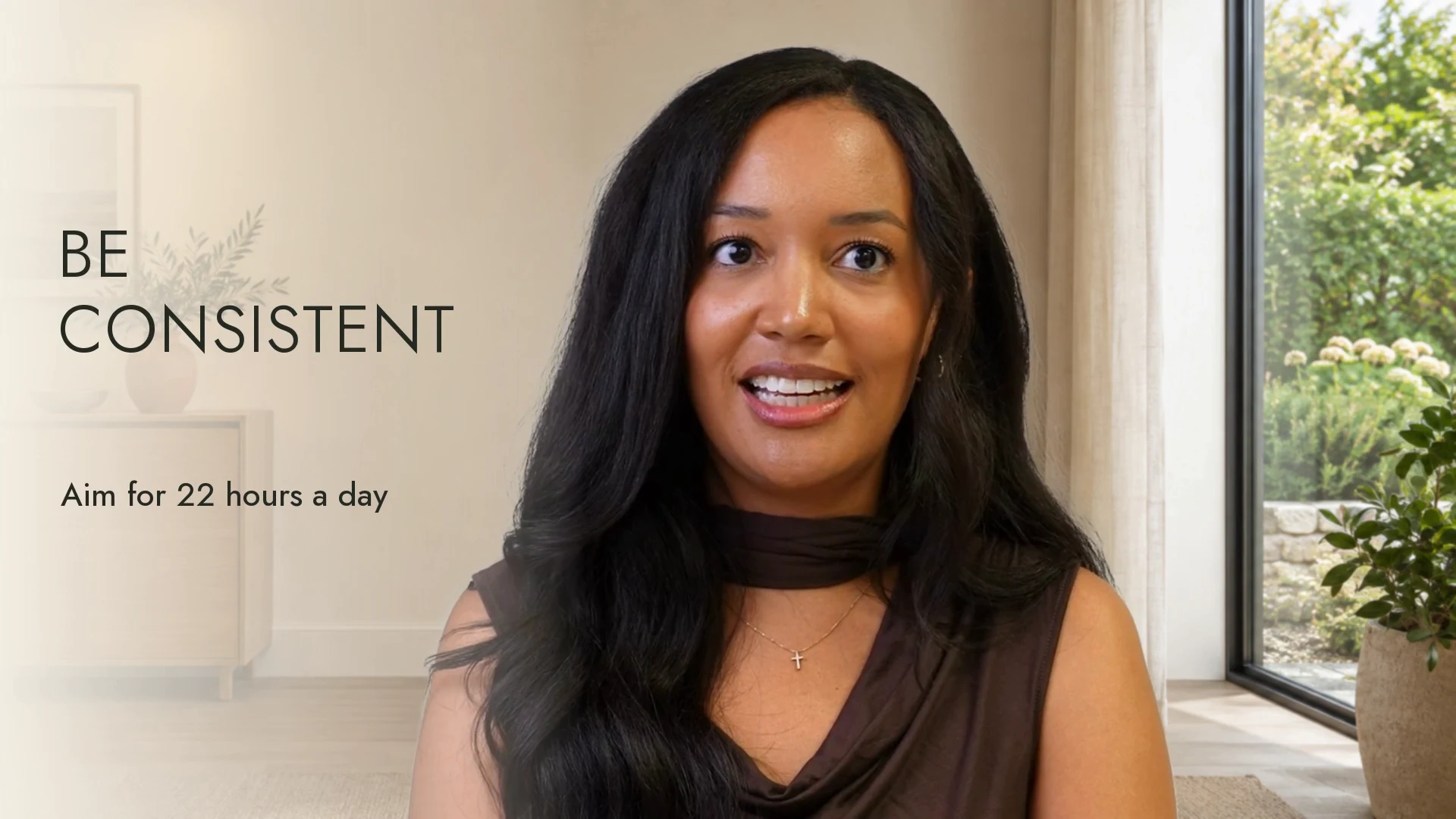Dr. Henderson in the refined video, with a contemporary consultation setting and closer framing.
